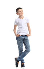 Stylish boy in jeans on white background