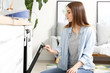 © Pixel-Shot - Young woman baking tasty pastry in oven