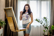 © Sokirlov - Young woman artist painting at home creative tools close-up