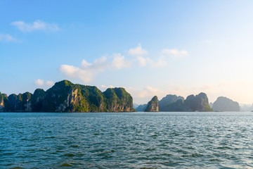 Beautiful scenery views cruising at Ha Long Bay, Hanoi, Vietnam.  blue sky background summer season sunset emerald waters ocean sea,  World Heritage Asia National Park Asian outdoors destinations