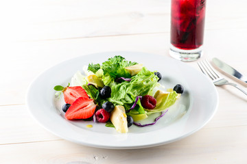 Poster - Fresh Blueberries, Cranberry salad with arugula, nuts, feta cheese, olive oil, herbs. Morning, breakfast healthy food.