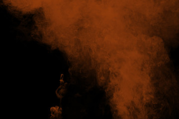 Wall Mural - abstract brown smoke on black background. brown color clouds.