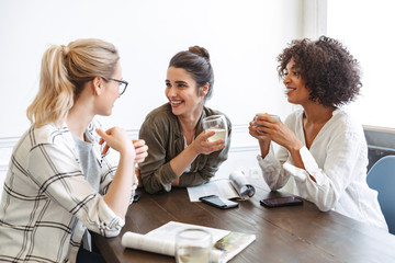 Sticker - Group of cheerful young women studying together