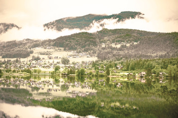 Canvas Print - Clouds and mist on the Hallstattersee in Austria.