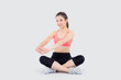 © NT_studio - Beautiful portrait young asian woman sitting stretch muscle arm isolated on white background, girl wear sport clothes exercise and yoga for health, wellness concept.