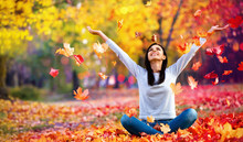Happy Woman Enjoying Life In The Autumn On The Nature