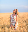 © AlexR - young seductive rural blond hair woman in dress on the yellow wheat field on the sunset