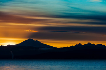 Wall Mural - Dramatic Sunrise Over Mt. Baker and Bellingham Bay.  First light behind Mt. Baker, Washington, can be a dramatic and colorful event in the Pacific Northwest.