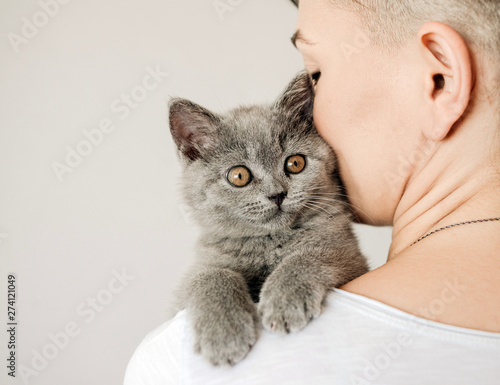 Beautiful Young Woman With Cute Cat Resting At Home The British