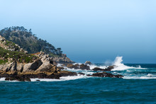 Large Waves Break Against The Rocks And Cliffs Of Point Lobos Under A Foggy And Misty Sky Near Carmel, California