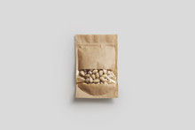 Pistachio Nuts In A Paper Bag Package With Window Isolated On Light Gray Background.Realistic Photo.3D Rendering.