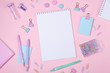 © lizaelesina - School background with notebooks and pastel colorful study accessories on pink background Back to school concept with copy space for text