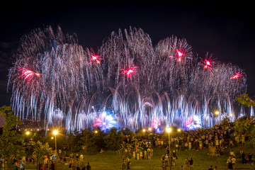 Red Fireworks light up the sky