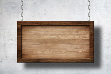 Large Wooden Sign Hanging On Chains With Concrete Wall Background