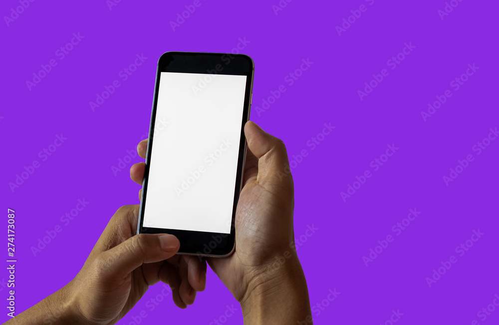 Hand holding white mobile phone with blank white screen in purple ...