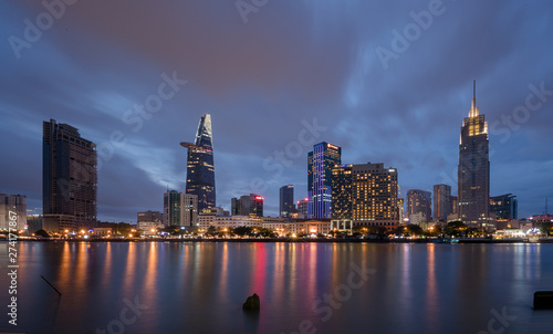 The best of night view in Ho Chi Minh City, Vietnam. Colorful of city light beside the Saigon river with skyline at sunset. Royalty high quality free stock image. © Longct84