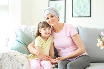 Sticker - Mature woman after chemotherapy with her granddaughter at home