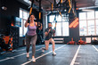 © Viacheslav Yakobchuk - Overweight woman feeling positive while exercising with TRX