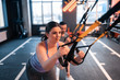 © Viacheslav Yakobchuk - Dark-haired overweight woman feeling tired working out with TRX