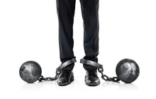 Guilty Businessman Shackled In The Iron Ball And Chain Isolated On White Background