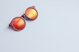 Fototapeta  - Red sunglasses on white background.
