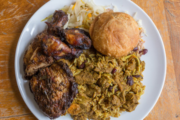 Wall Mural - Jamaican curry goat, jerk chicken and fried dumpling