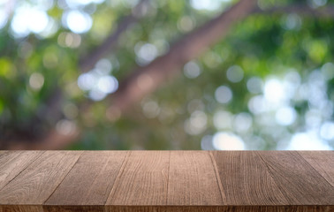 Empty dark wooden table in front of abstract blurred bokeh background of restaurant . can be used for display or montage your products.Mock up for space.