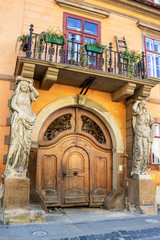 Wall Mural - House with Caryatids or Bethlen House entrance in Sibiu, Transylvania, Romania