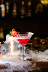 Sticker - strawberry margarita cocktail with cold smoke at a nightclub