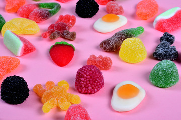 Wall Mural - group of gummy candies on pink background