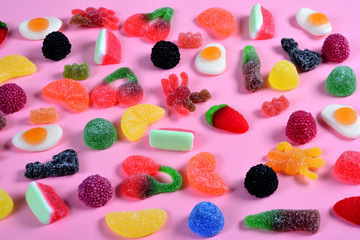 Wall Mural - group of gummy candies on pink background