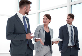 Wall Mural - employees discuss something standing in the office