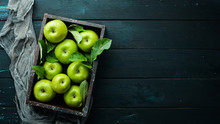 Fresh Green Apples With Green Leaves On A Black Background. Fruits. Top View. Free Space For Text.