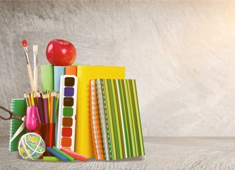 Poster - Colorful school supplies on wooden table background