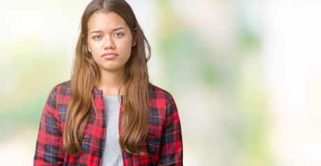 Sticker - Young beautiful brunette woman wearing a jacket over isolated background Relaxed with serious expression on face. Simple and natural looking at the camera.