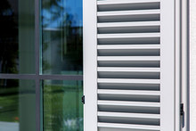 Wooden Shutters Of Gray Color, Close Up Of The Exterior Of The House In The Italian Style.