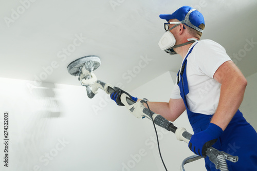 Painter Work With Ceiling Polishing And Sanding The Surface