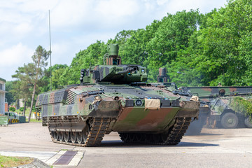 Wall Mural - German infantry fighting vehicle drives on a street