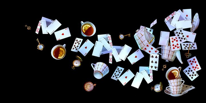 wonderland background. mad tea party.playing cards, pocket watch, key, cup and teapot falling down t