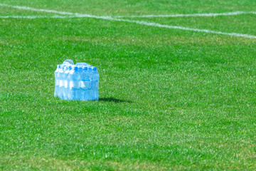 water bottles on green grass