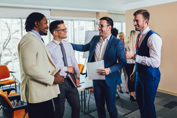 Wall Mural - Young and successful business team in office. Selective focus.