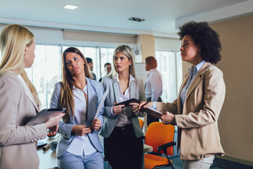 Wall Mural - Business team of women with tablet pc computer at office.