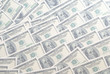 © Azazello - Dollars background. One hundred dollar banknotes.