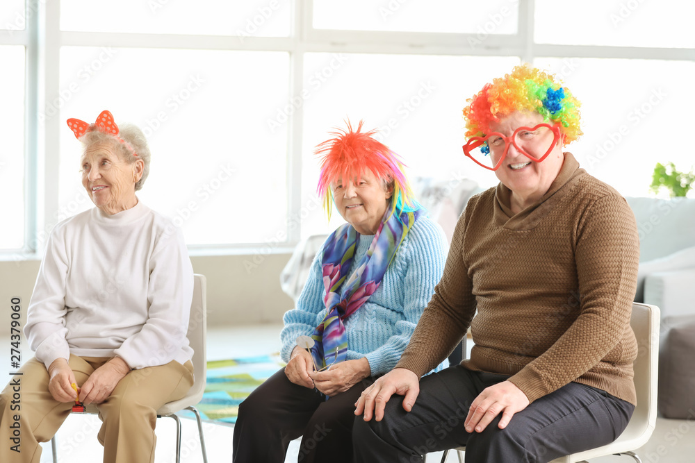 Happy senior people spending time together in nursing home