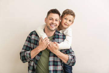 Poster - Happy man with little adopted boy on white background