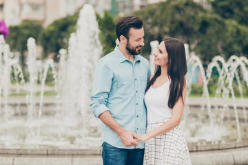 Poster - Portrait of married youth lovely charming rest relax hold hand nature fountain enjoy free time vacation spring trendy stylish clothing dress skirt shirt blue denim jeans outside bearded