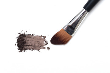 Make up brush with selection of colored make up powder