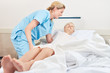 Nursing lady embeds senior patient