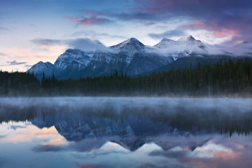 Wall Mural - hebert lake with mountain reflection, banff national park , alberta, canada beautiful foggy morning 