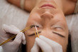 © Nejron Photo - Procedure of eyelash extension in salon by cosmetician